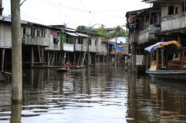 Idee Montijo's image of Belen residents floating in small boats along the flooded roadways.