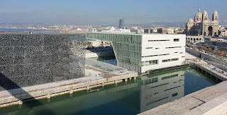 The Villa Méditerranée in Marseille, with the city's Romanesque-Byzantine style cathedral in the distance