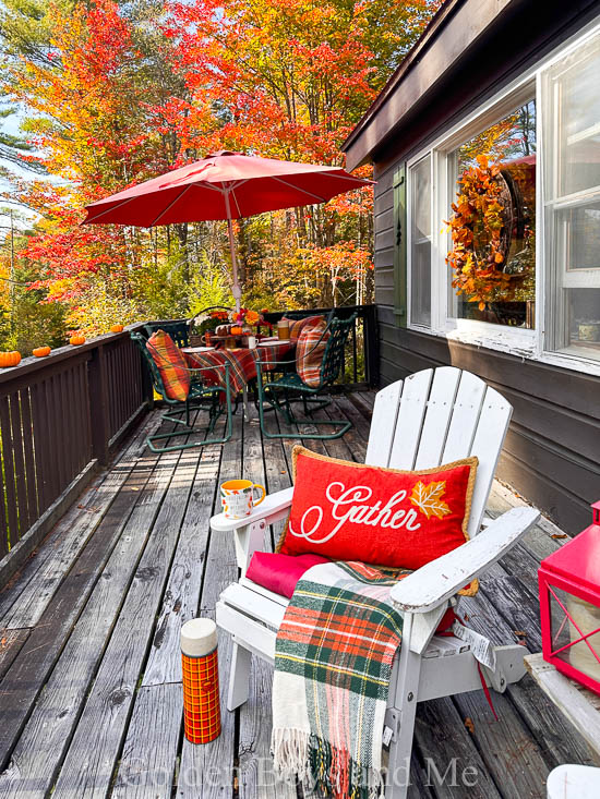 Porch at cabin with fall decor - www.goldenboysandme.com
