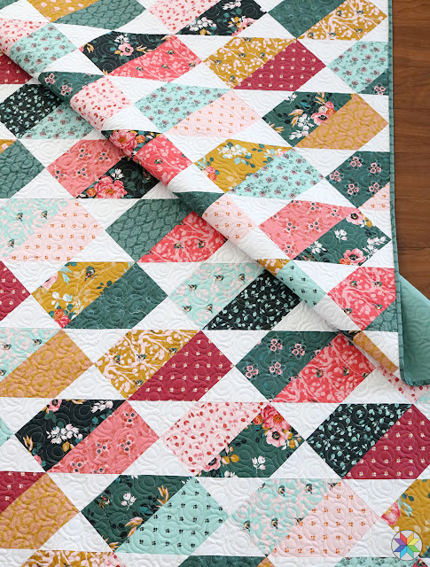 Plot Twist quilt pattern by Andy Knowlton of A Bright Corner a modern layer cake and fat quarter quilt pattern with five sizes