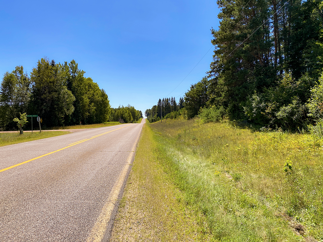 paved highway rolling over hills