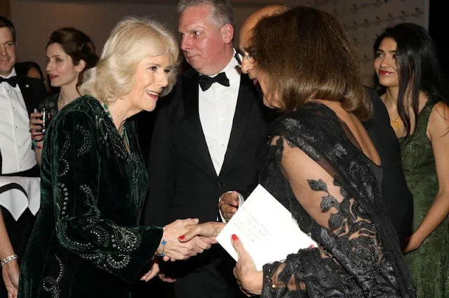 The Duchess of Cornwall wore a green kaftan-style embroidered dress. She wore green trousers and a emerald necklace