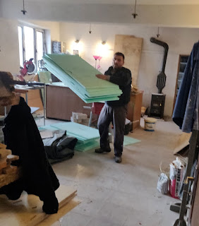 Halil shifting insulation out of the workshop