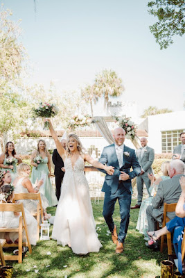 bride and groom cheering