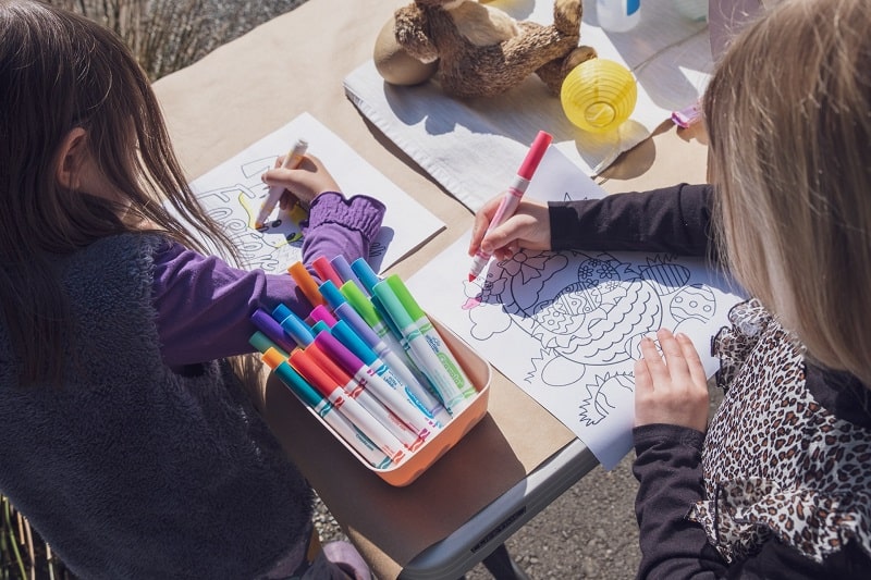 kids coloring in Easter pages