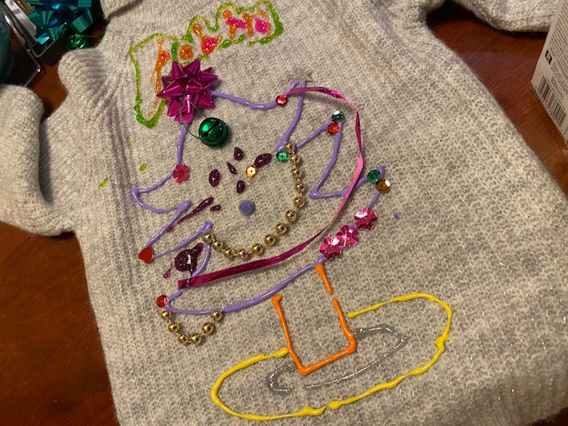 Homemade Christmas jumper covered in thread, glitter, sequins, ribbons and bells