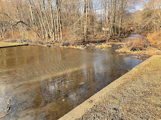 The end of the pond flowing into a river.