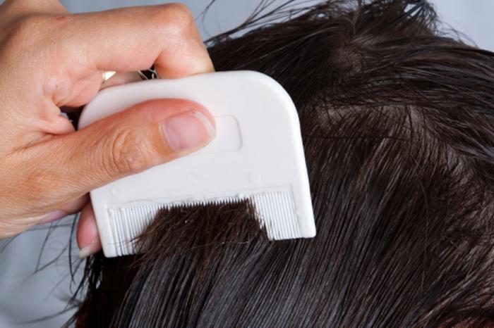 Woman combing her hair