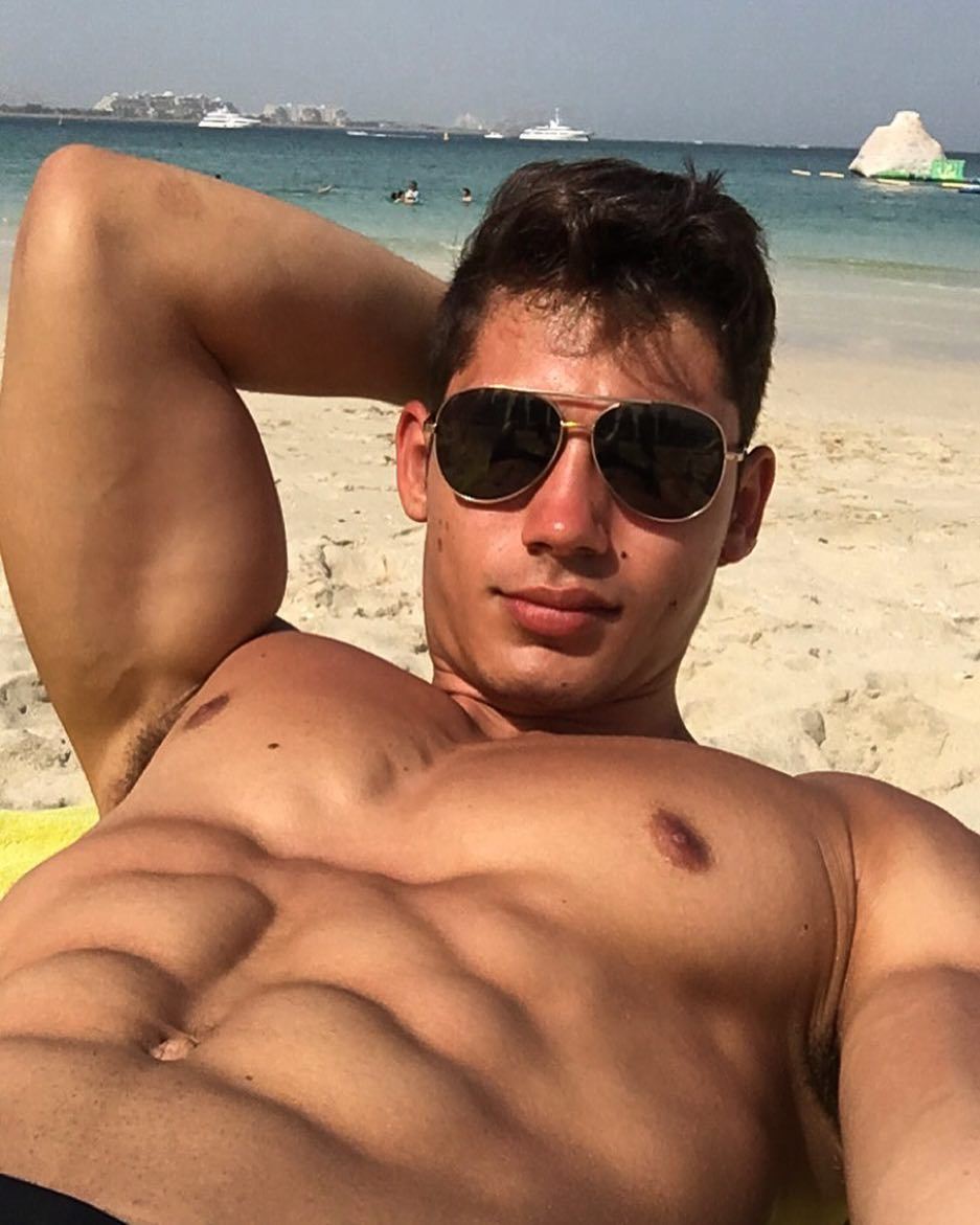 cocky-fit-shirtless-young-guy-fernando-skinner-beach-sunglasses