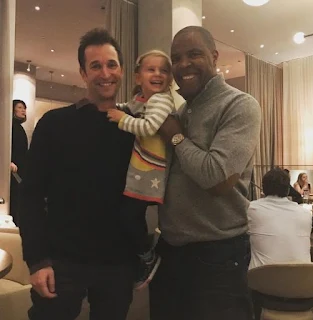 Picture of Eriq La Salle carrying kid along with his friend