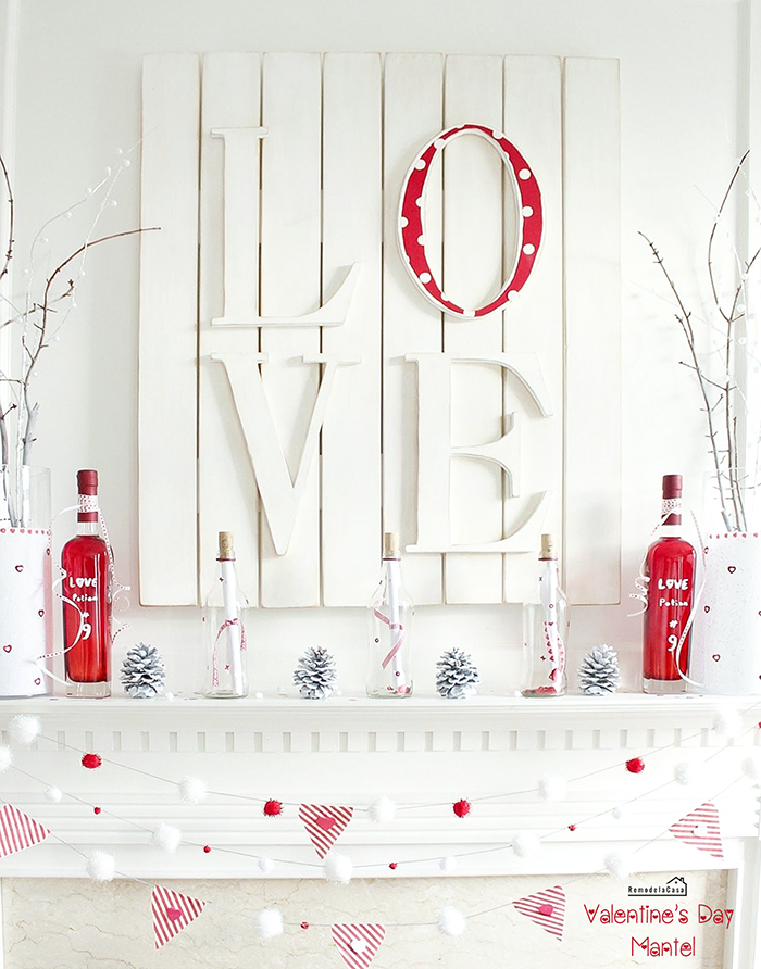 red and white valentines mantel with LOVE art and Love potion No.9