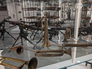 trumpets and artillery sit in open storage at the National WWI Musuem