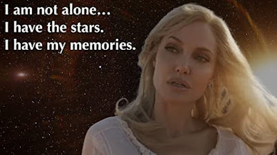 A starlit photo of Angelina Jolie in her Athena look with the caption I am not alone... I have the stars.  I have my memories.