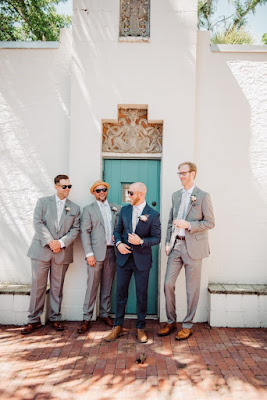 groom laughing with groomsmen