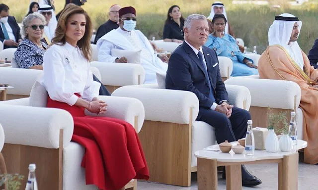 Queen Rania wore a ruth wool-crepe red midi skirt from Emilia Wickstead. The 2022 Zayed Award for Human Fraternity