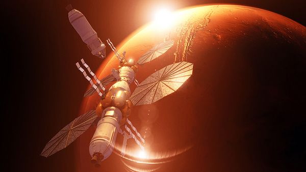 An artist's concept of the Excursion Module about to dock with Lockheed Martin's Mars Base Camp above the Red Planet.