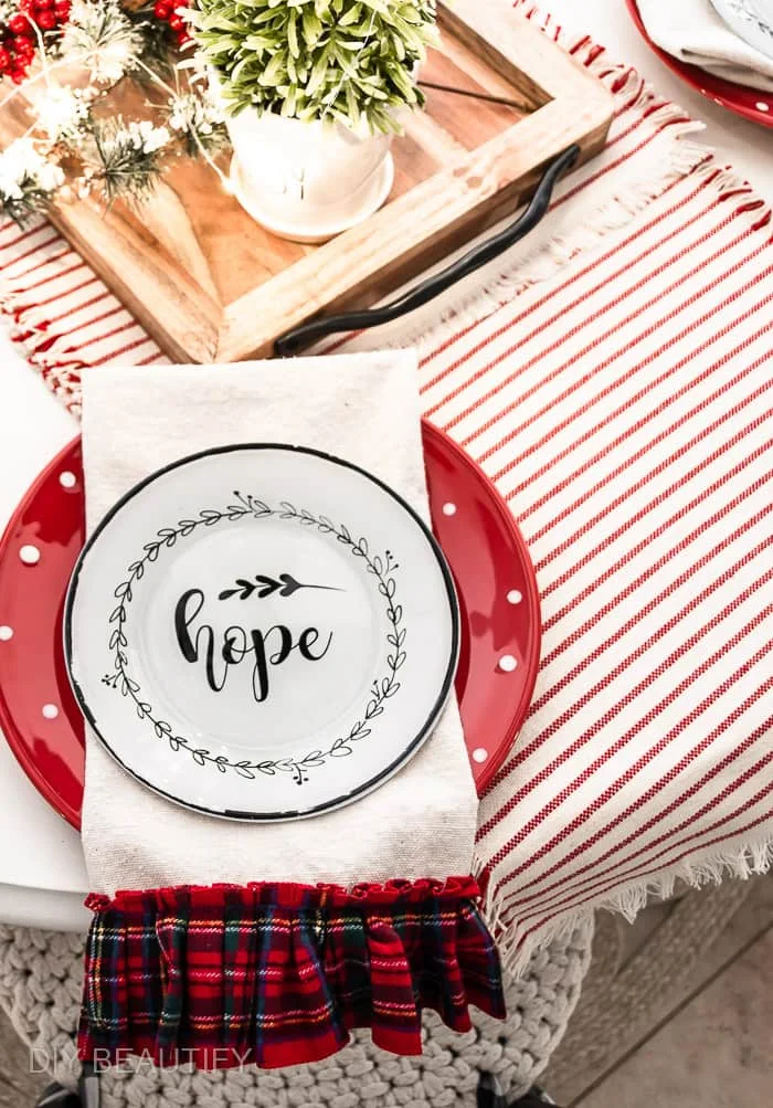 red striped runner, red polka dot plates and drop cloth napkins edged in ruffled plaid trim
