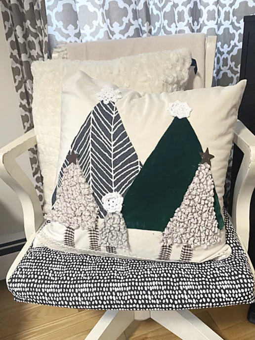Christmas tree pillow on a chair