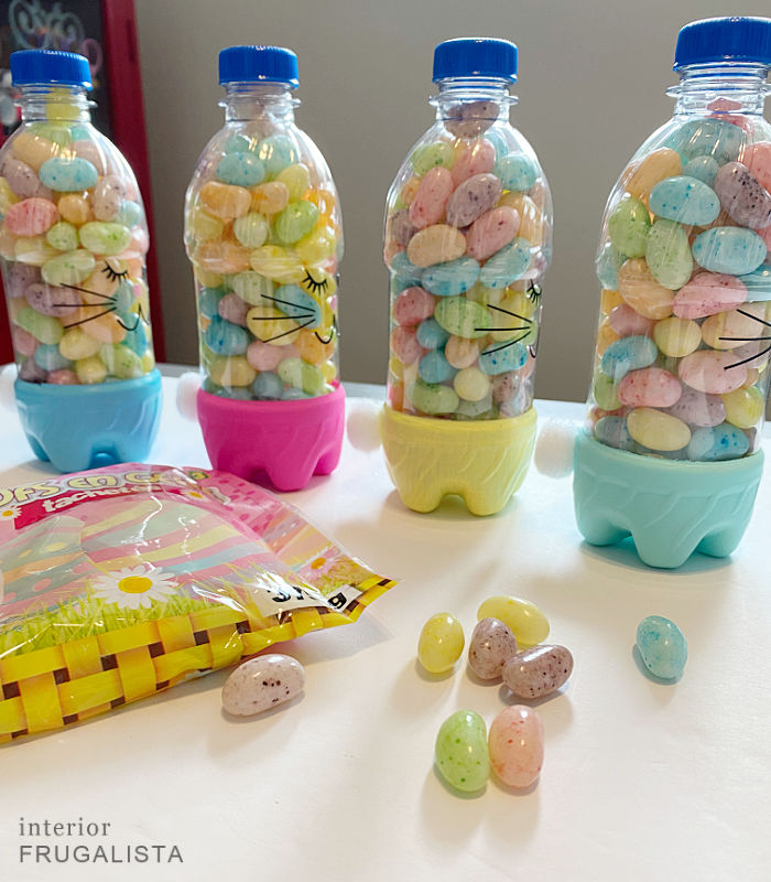 Recycled plastic bottle bunnies filled with colorful jelly bean treats.