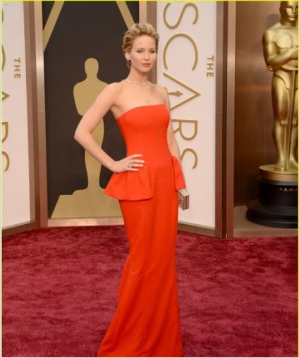 Jennifer Lawrence in an orange gown at 2014 Oscars
