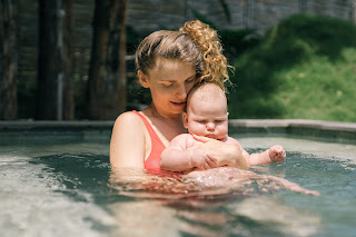 Image of mother and baby enjoying themselves in the pool: This post is about, Benefits of Parents Participation in Swim Classes