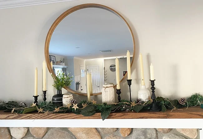 black matte candlesticks on winter mantel