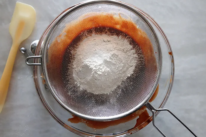 set sieve over bowl to sift in dry ingredients