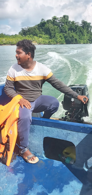 On the speedboat on a 9 Km journey to Limestone caves.