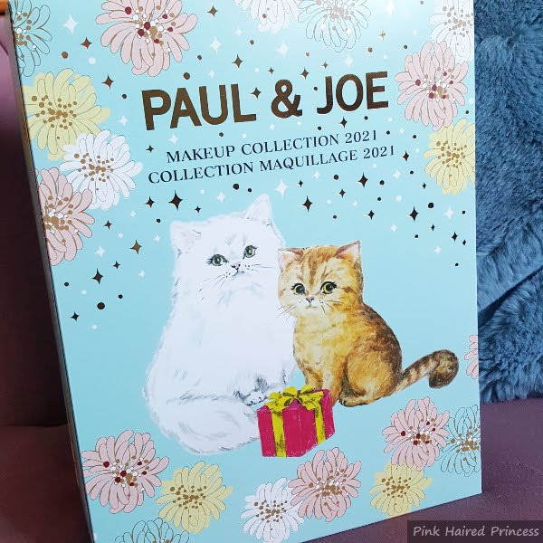 front of blue Paul & Joe Makeup Collection 2021 calendar with cat illustration