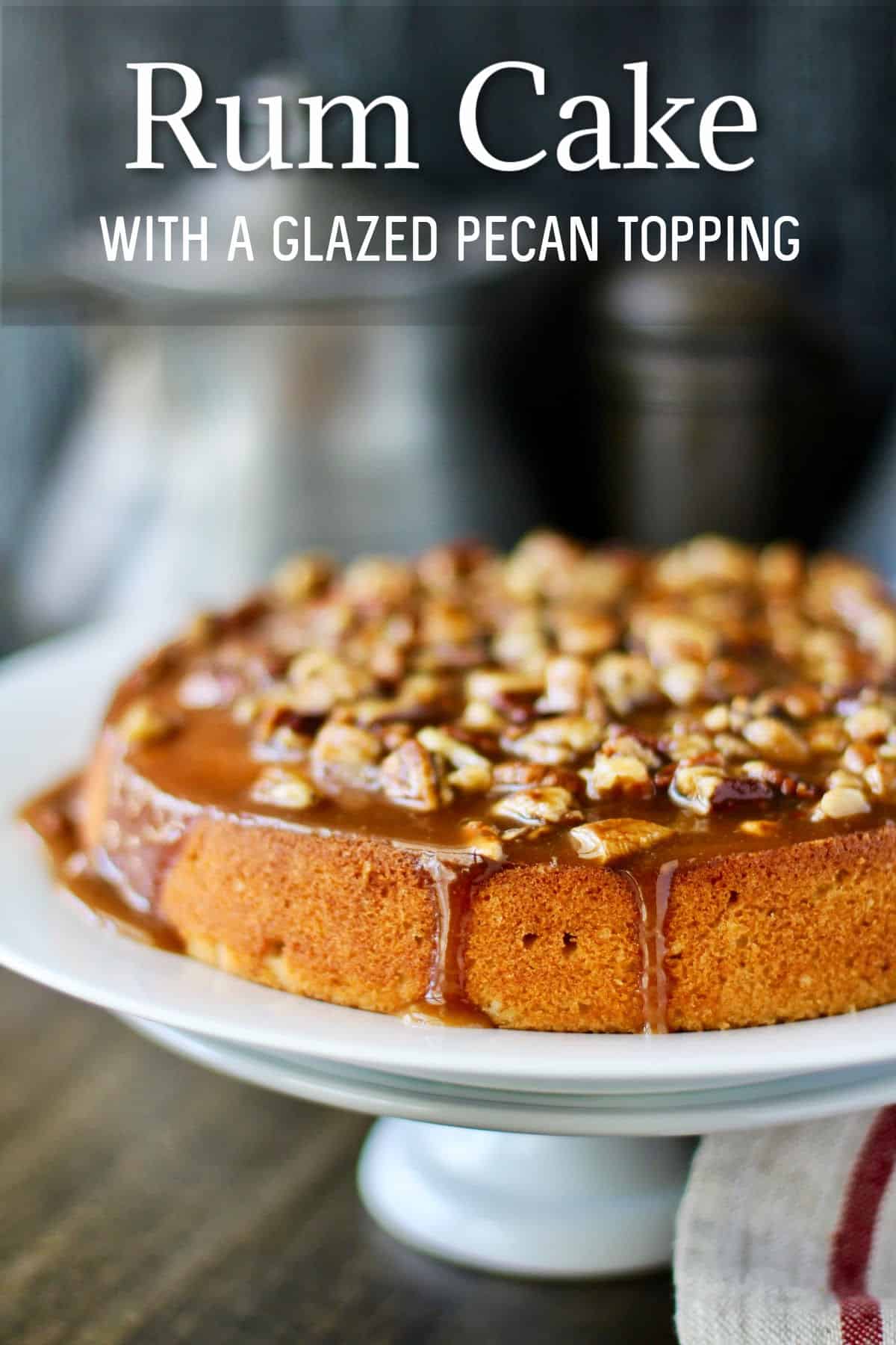 Rum Cake with Glazed Pecan Topping on a cake stand.