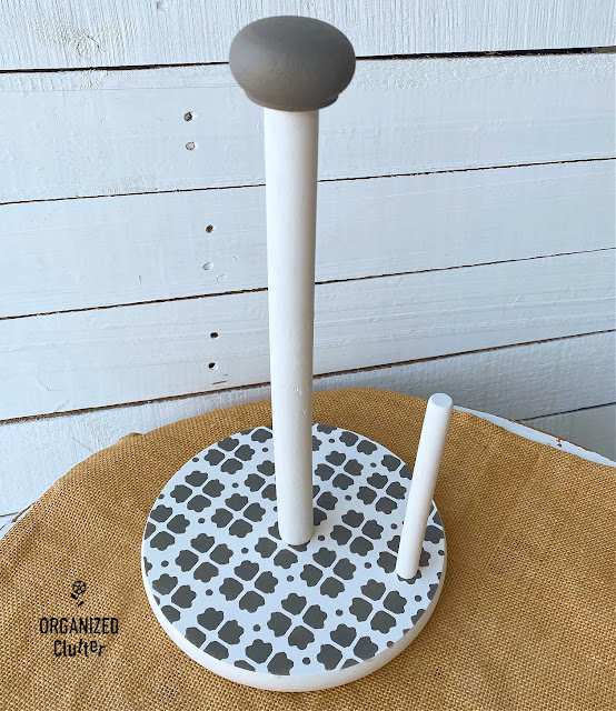 Photo of a standing paper towel holder upcycled with Dixie Belle Chalk Paint & a patterned stencil.