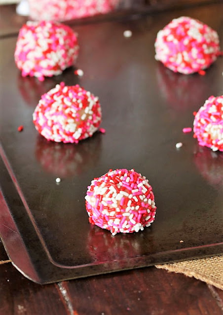 Sugar Cookie Dough Ball Coated in Valentines Sprinkles Image