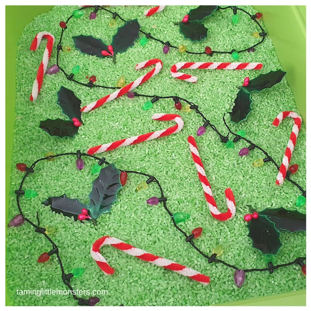 green rice christmas sensory bin.