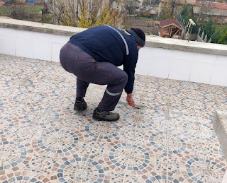 Halil gets started on the grouting this morning