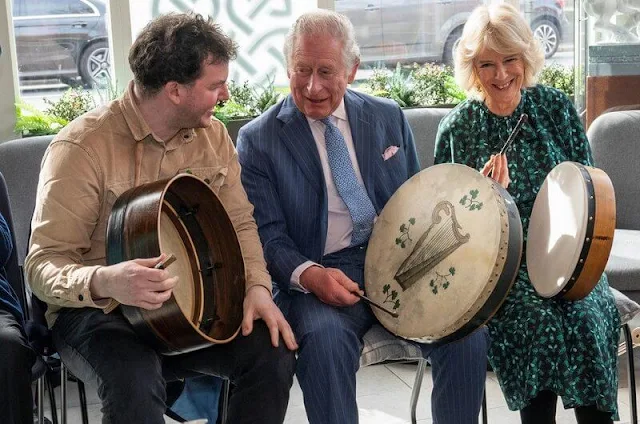 The Duchess of Cornwall wore a green silk midi dress by Samantha Cameron's label Cefinn. Irish Cultural Centre in Hammersmith