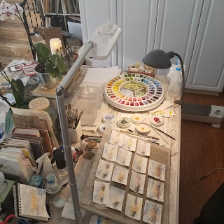 My work table with all the minis in progress.  © Christy Sheeler Artist 2022