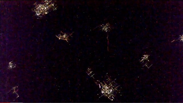 UFO wreckage flying past the ISS.