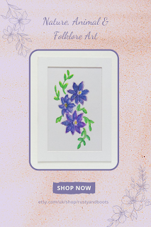 A watercolour illustration of blue clematis flowers in a pin for Pinterest saying nature, animal and folklore art, shop at etsy.com/uk/shop/rustyandboots