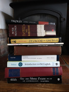 An image of a pile of books in a fireplace