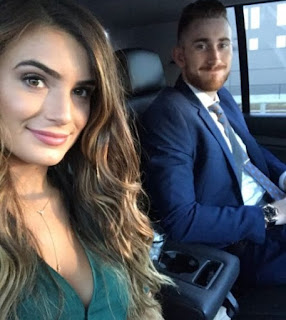 Robyn Hayward clicking selfie while sitting inside the car with her hubby
