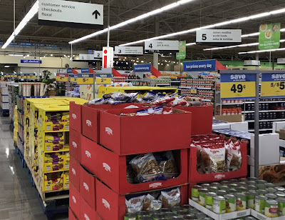 palettes of food and drink fill the extra-wide space at the end of the normal aisles