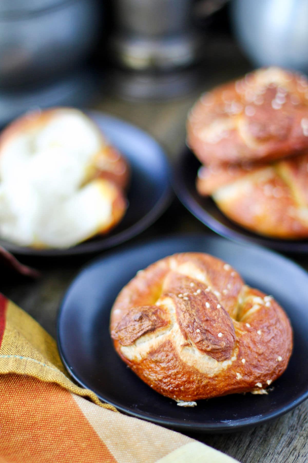 Soft Sourdough Pretzels on plates.