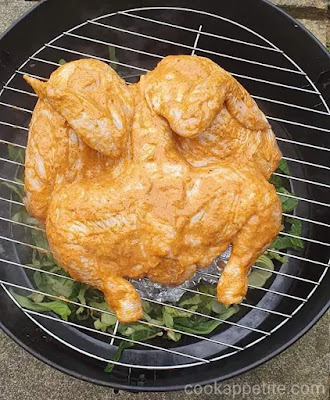 Once the smoker is preheated  place the whole chicken on the wire rack breast side up and close your smoker.