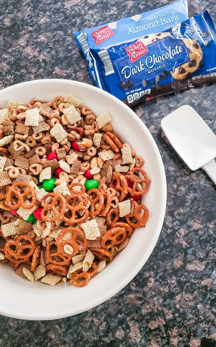 cereal, nuts, pretzels and M&Ms mixed in bowl