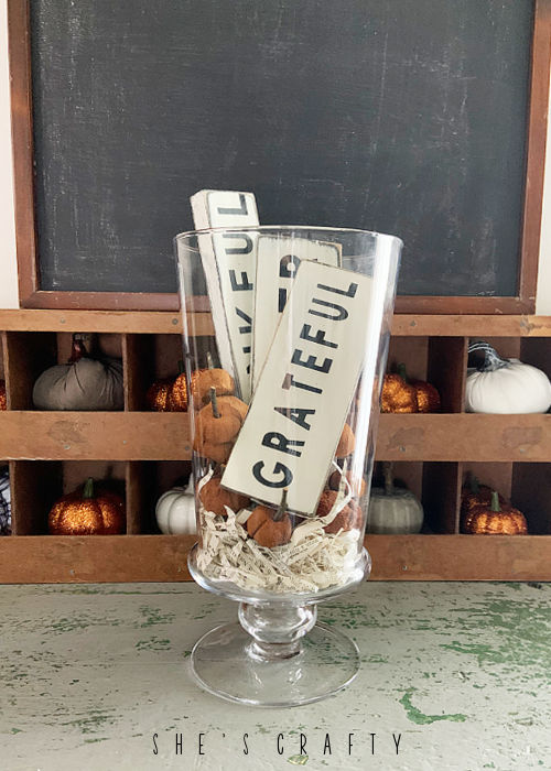 Fall Signs and Cinnamon Pumpkins in a Thanksgiving Centerpiece.