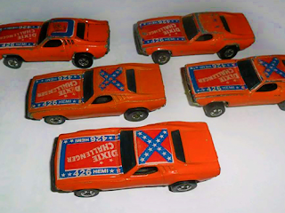 Several variations of the Dixie Challenger. Some with Confederate flags on their roofs.