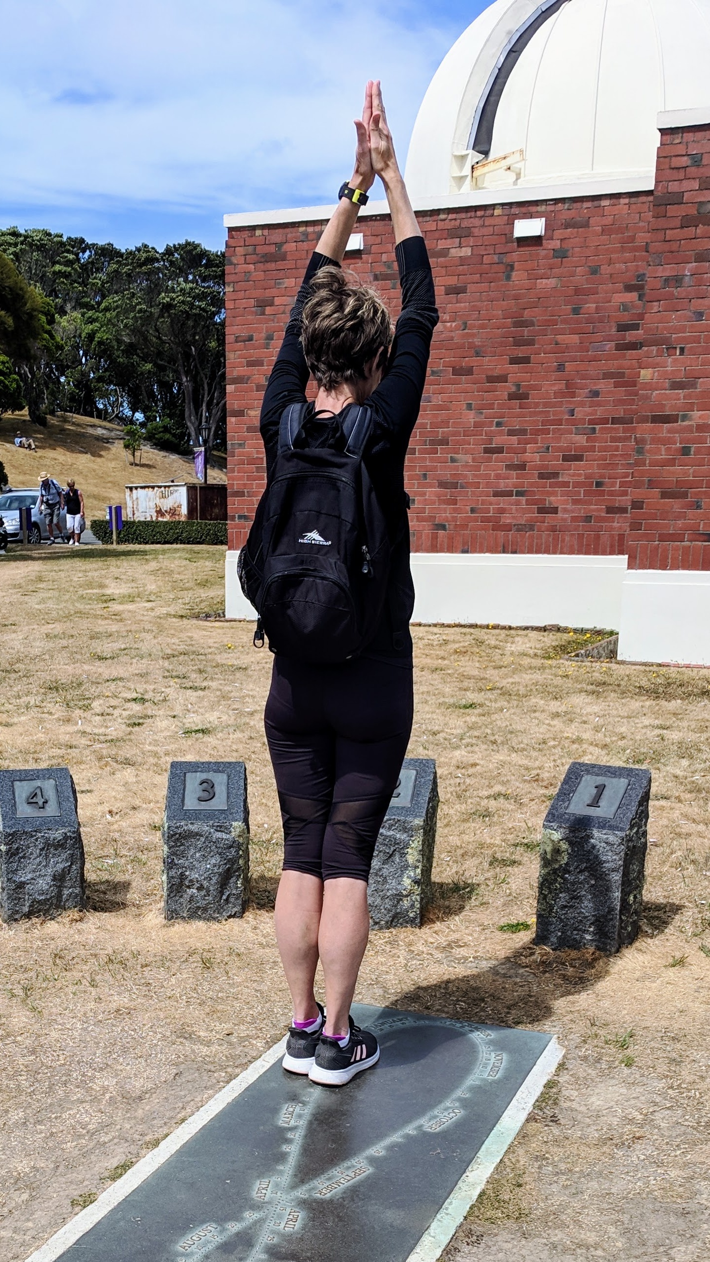 Woman on a human sundial proving it works