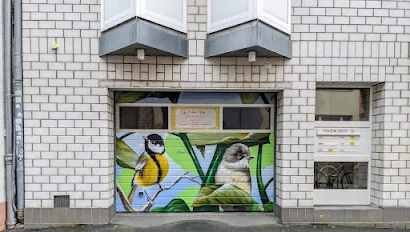 Garage door with bird street art painted on it in Mainz Germany