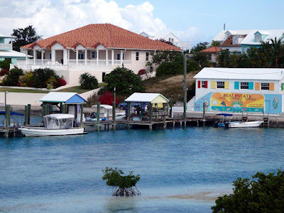 harbour with boats and homes on shore