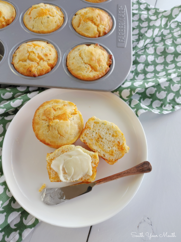Cheddar Garlic Muffins! A quick and easy recipe for tender, savory muffins packed with cheddar cheese and garlic. An easy way to put fresh, hot, homemade bread on the table without much fuss!